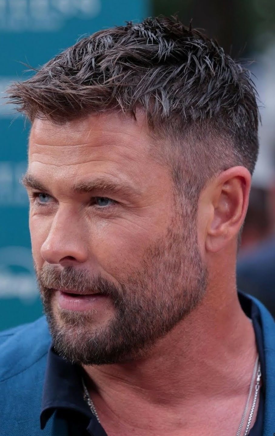 Chris Hemsworth with short textured hair and tapered sides