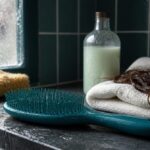 Ultimate Detangler brush with a broad head and solid handle